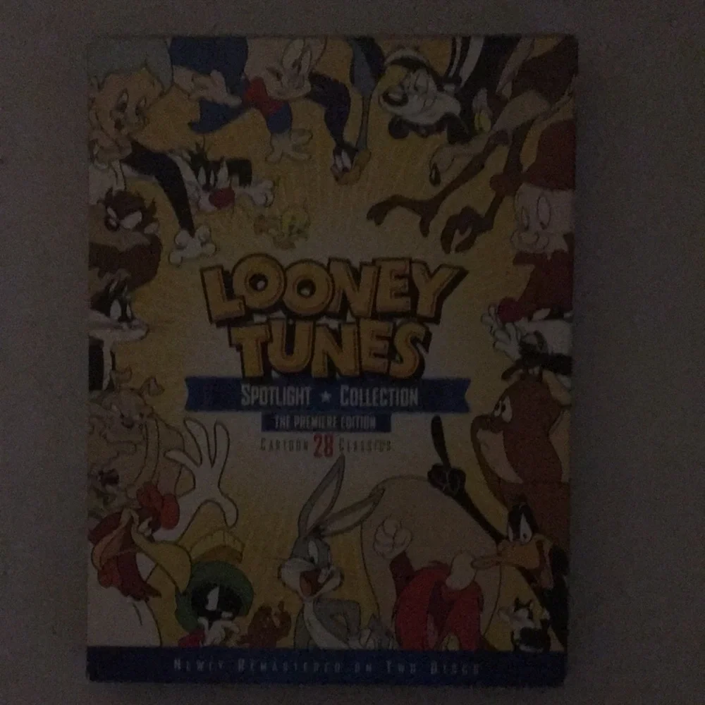 DVD OF LOONEY TUNES SIZES 2 ARE 3 INCH’S TALL